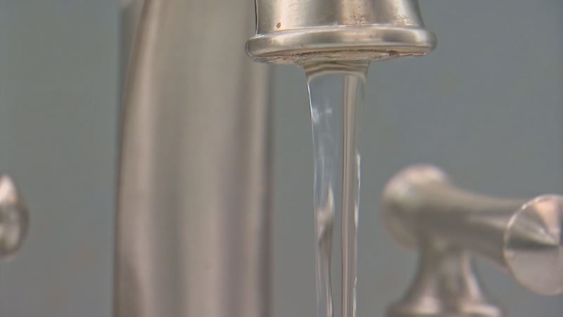 Water pours out of a faucet