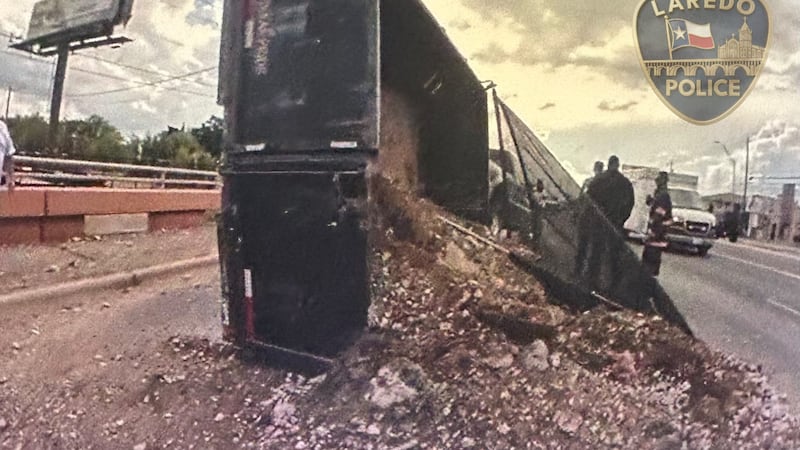 Truck rollover closes lanes on E. Saunders St.