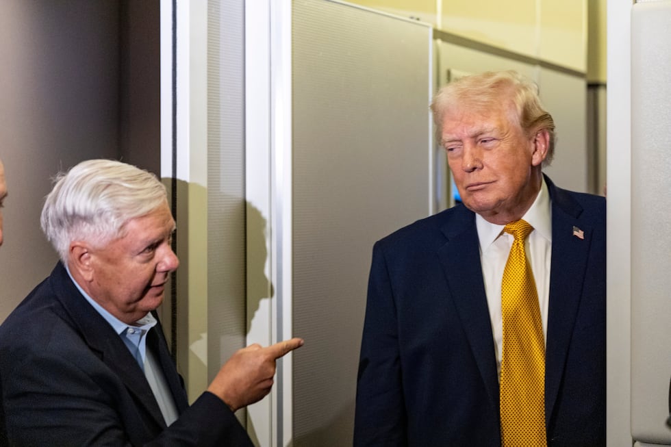 FILE - Sen. Lindsey Graham, R-S.C., left, gestures as President Donald Trump speaks with...