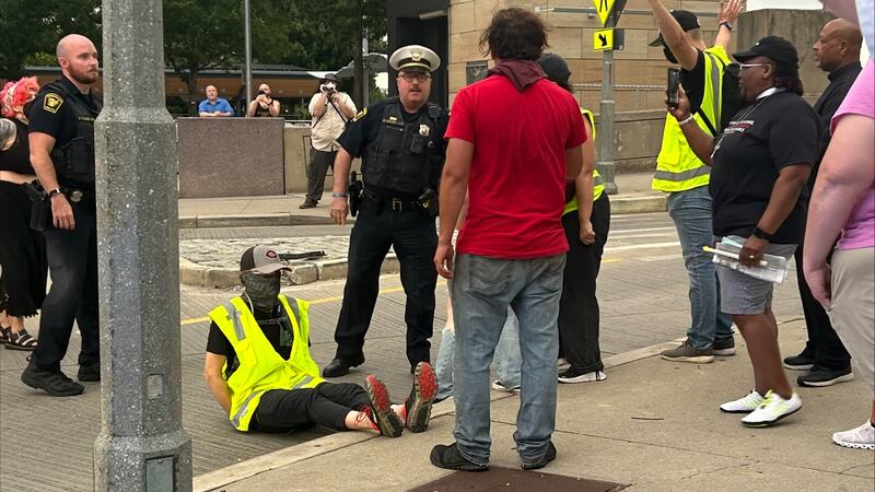 At least 13 were arrested after a vigil turned into a blockade on the Roebling Bridge.