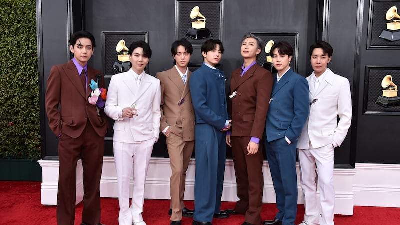 FILE - BTS arrives at the 64th Annual Grammy Awards at the MGM Grand Garden Arena on Sunday,...
