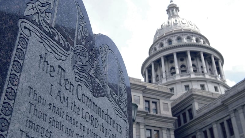 FILE - This 5-foot tall stone slab bearing the Ten Commandments stands near the Capitol in...