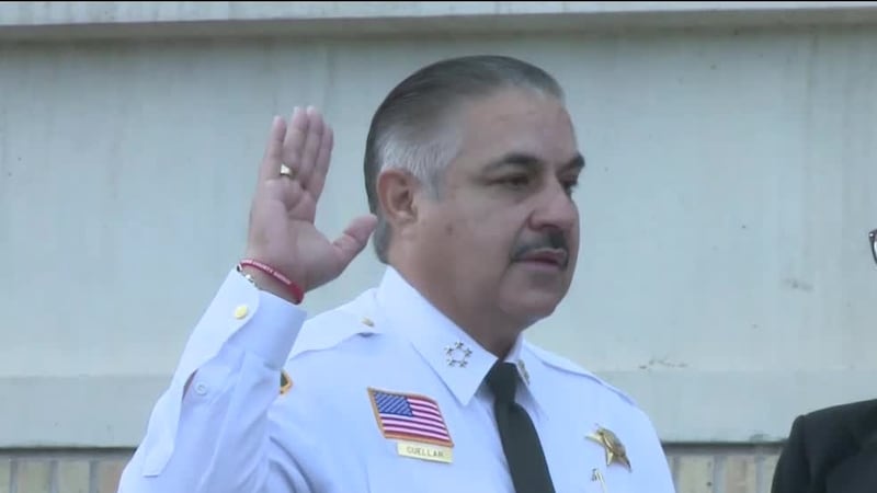 Dozens of deputies showed up to the swearing in of Webb County Sheriff Martin Cuellar (left).