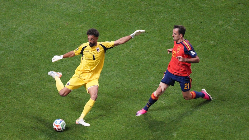 Cape Verde goalkeeper Vozinha (1) kicks the ball under pressure from Spain's Mikel Oyarzabal...