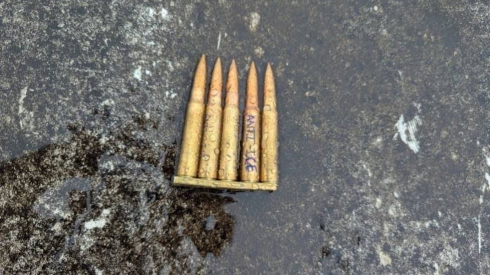 Authorities say they found ammunition with anti-ICE messaging at the scene.