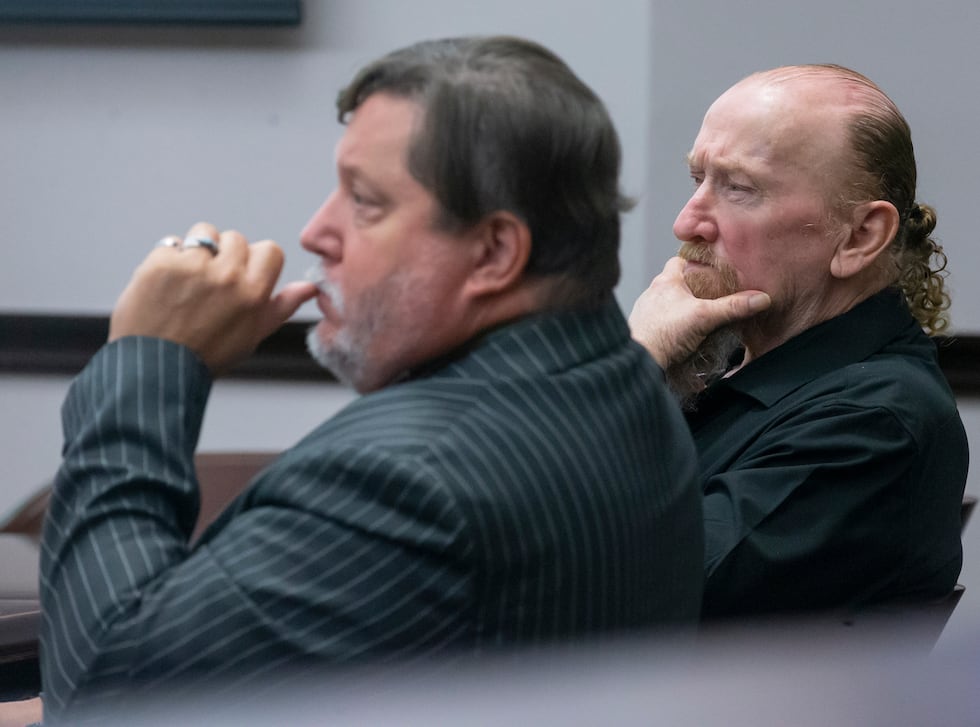 Defendant James Dolphs Elmore Jr., right, sits with his attorney, William Agnew, while...