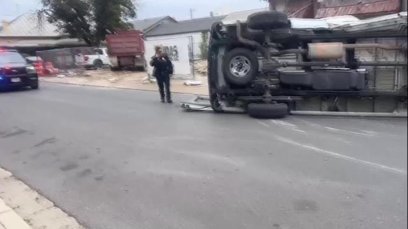 2-vehicle crash leaves van overturned on Houston St.